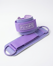 A purple PUMPT brand wrist and ankle cuff shown coiled on a clean white background.