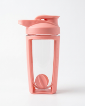 Pink shaker bottle with a clear compartment on a white background