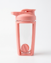 Pink shaker bottle with a clear compartment on a white background