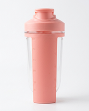 Pink shaker bottle with clear compartment on a white background