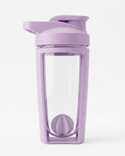 Purple shaker with a clear section and plastic whisk ball inside on a white background